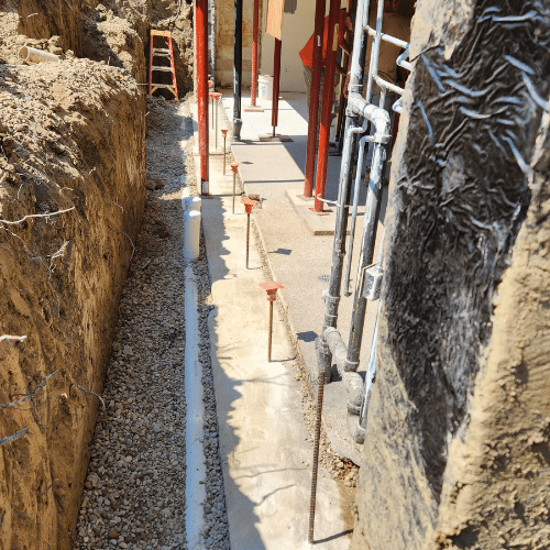 Step 3: Install new footing (if clay walls), or utilize existing code compliant footing. Install vertical rebar & draintile/stone.